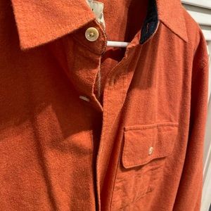 The normal brand rust chamois woven size medium. NWT